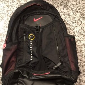 Pink and black Nike backpack